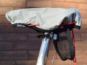 North Street Saddle Cover with mesh pouch. The pouch attaches to the saddle rails with Velcro.