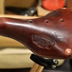 Close-up of a brown leather Brooks bicycle seat