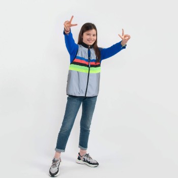 Full body shot of child modeling rainbow safety vest.
