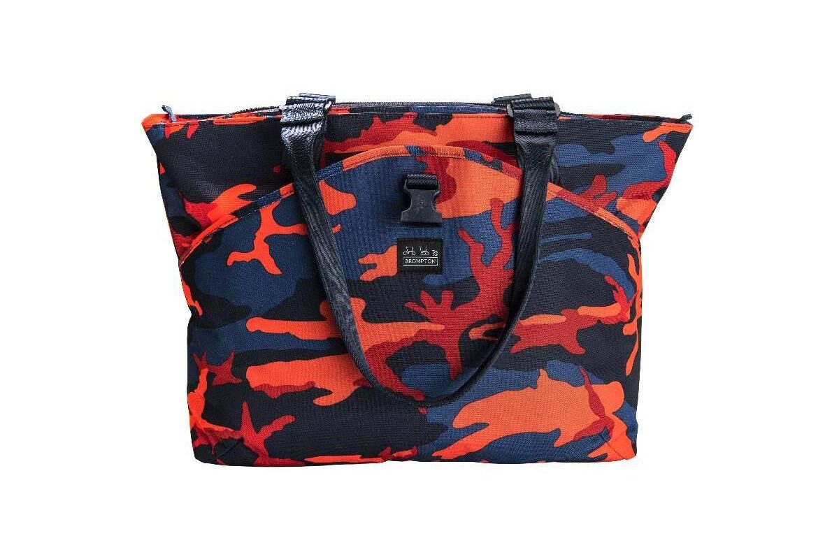 Tote bag with camouflage print in orange, red, black, and navy blue.